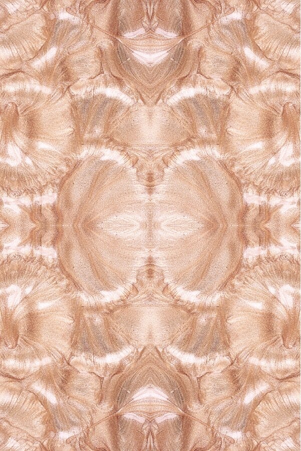 Abstract metallic pink and beige marble pattern.