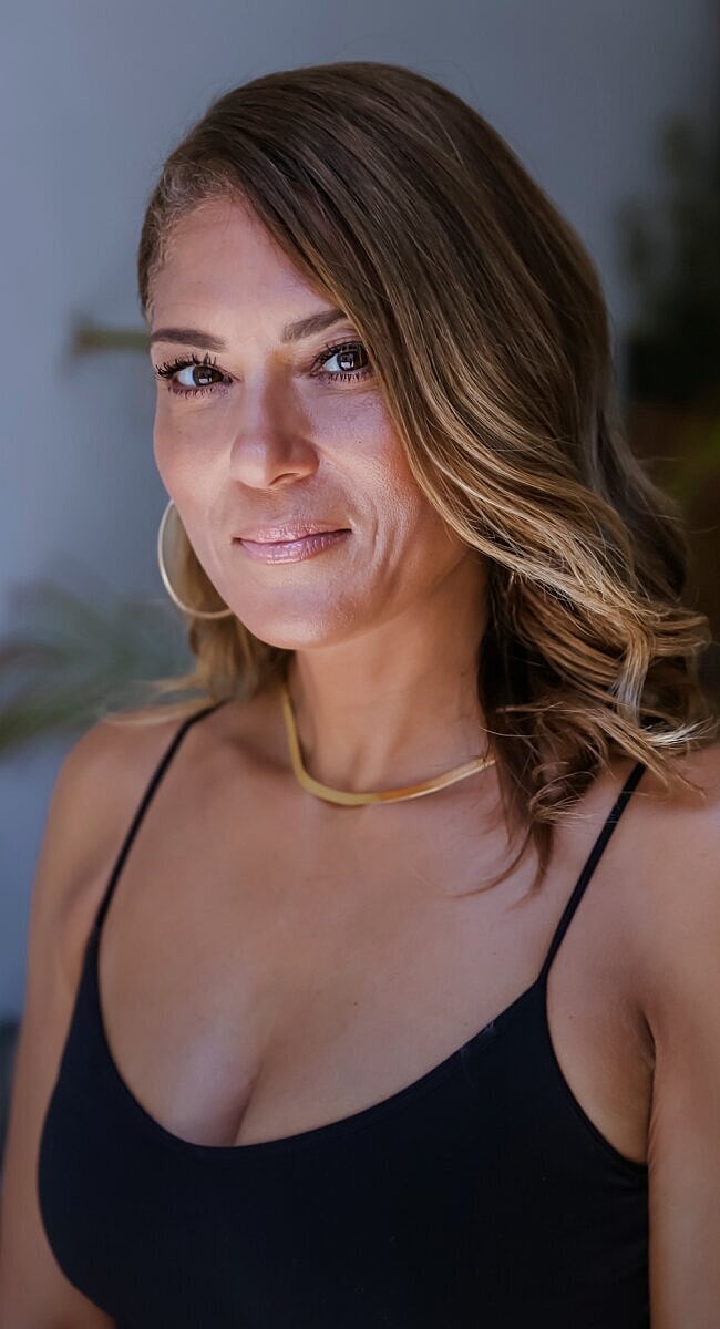 Portrait of a woman with wavy hair.