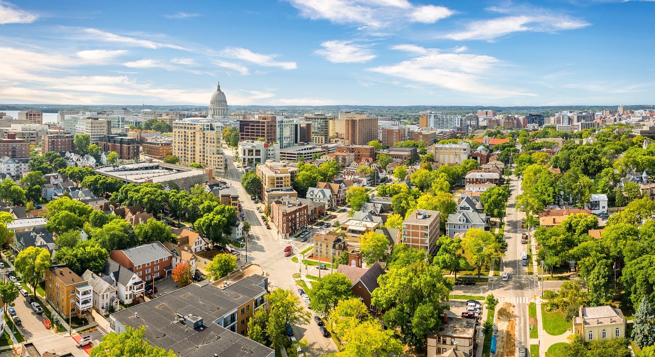 Aerial view of urban cityscape with greenery.