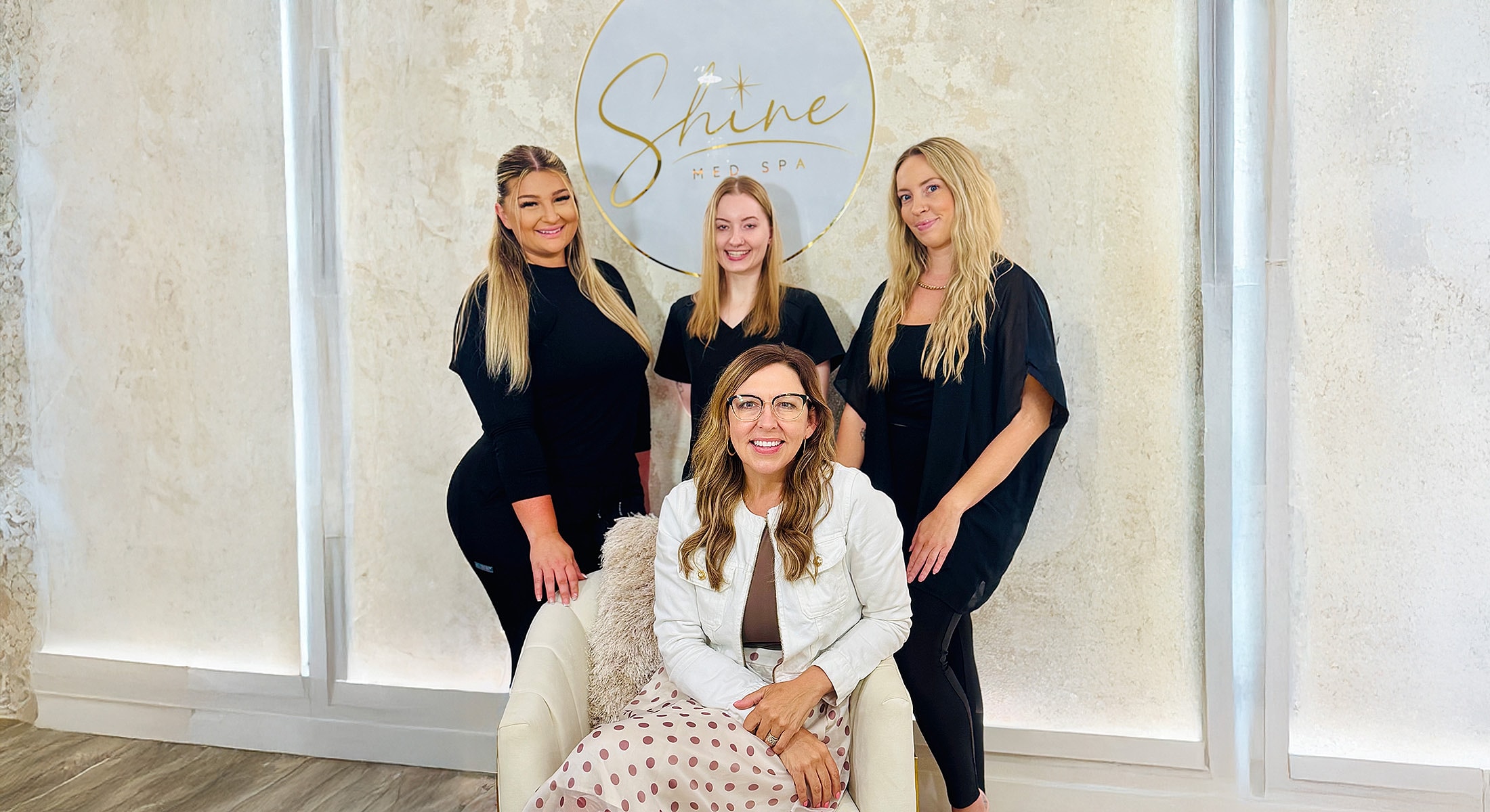 Four women posing at Shine Med Spa.